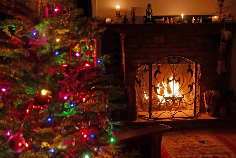 Fireplace with safety screen and christmas tree