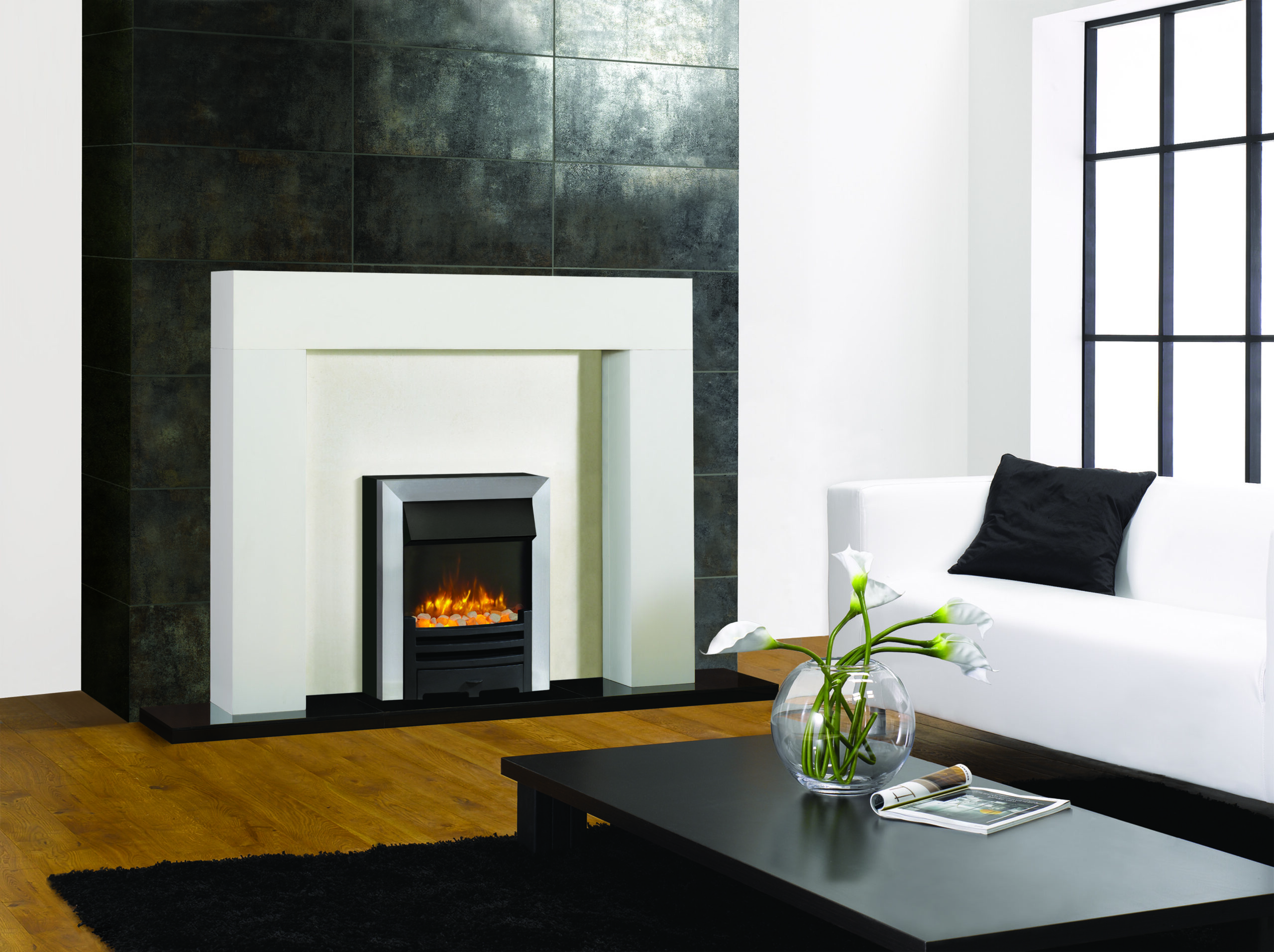 Logic2 Electric Arts with Matt Black Fret and Brushed Steel effect Frame and spacer frame. Shown with Stovax Malmo Mantel